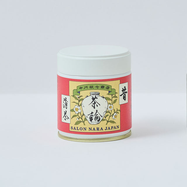 Tea canister with a colorful label on a white background